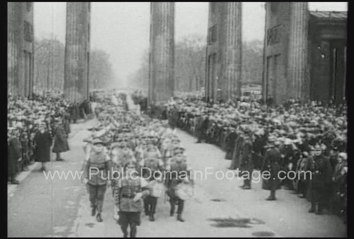Nazi soldiers March in Berlin as German Citizens Watch and Give the Nazi salute 1933