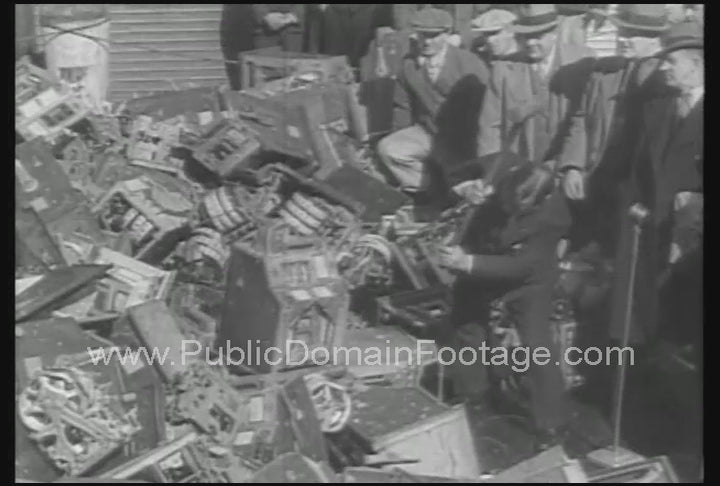 New York City Mayor Fiorello La Guardia Smashes illegal Slot Machines and Throws them into Long Island Sound 1934