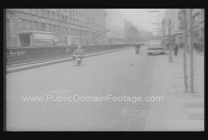 Man Rides Mini-Motorcycle at the Office